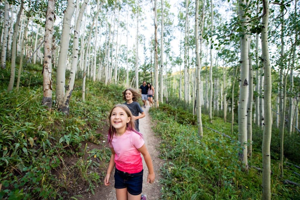 Kids running down a Breckenridge hiking trail