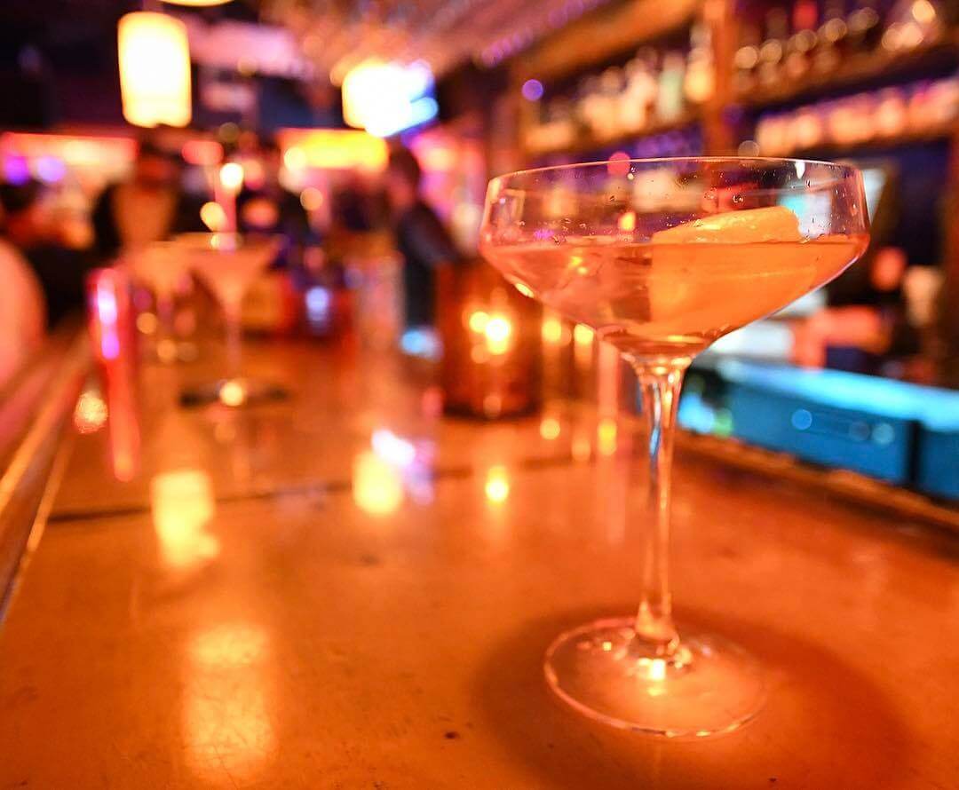close up of martini on a bar