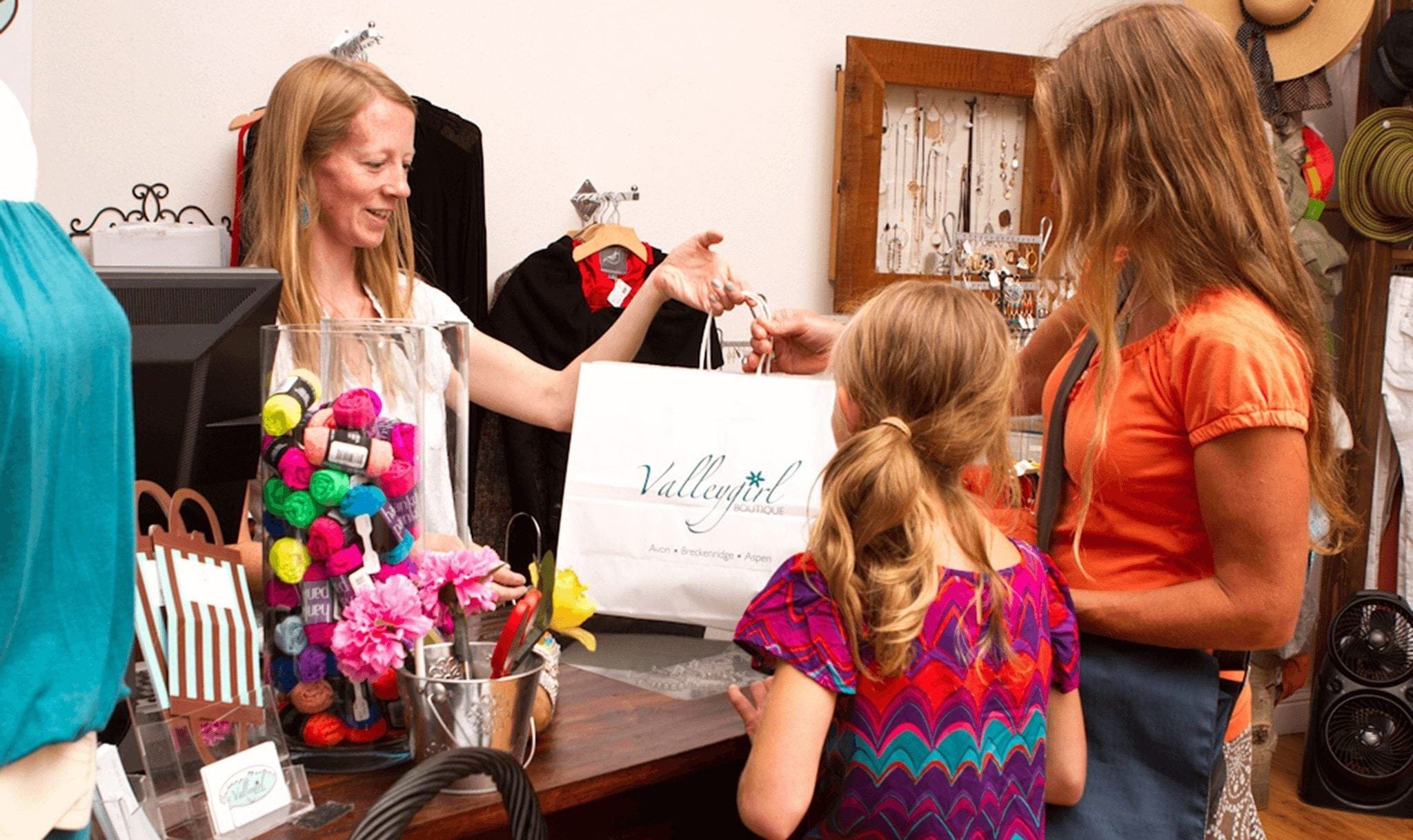 A mother and daughter checking out at Valleygirl while shopping.