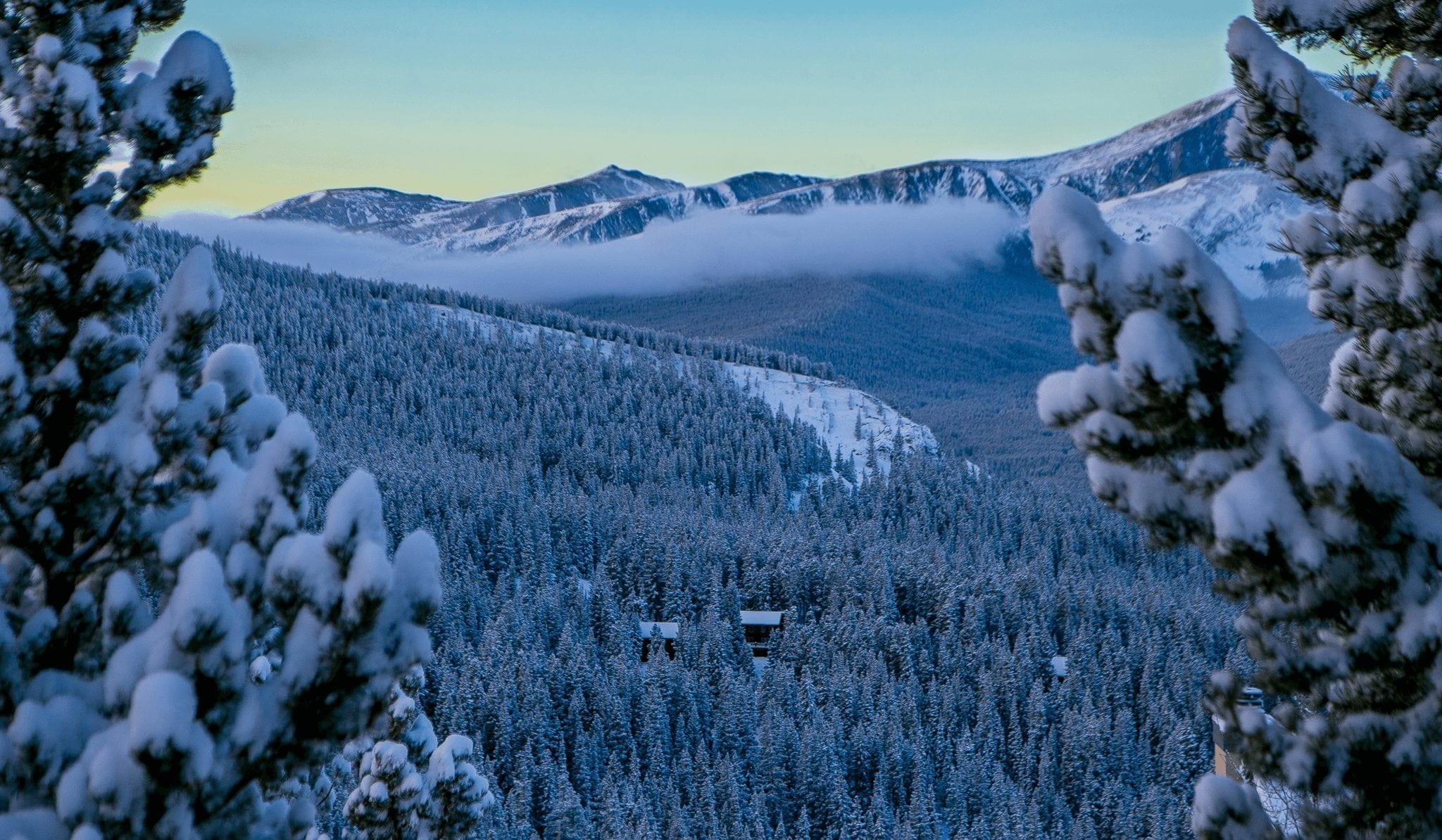 Sunrise with snow in the Breckenridge mountains during Breckenridge in December.