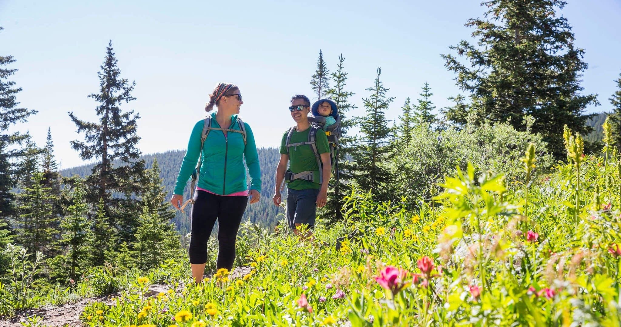 Couple hiking on wildflower trail in Breckenridge CO