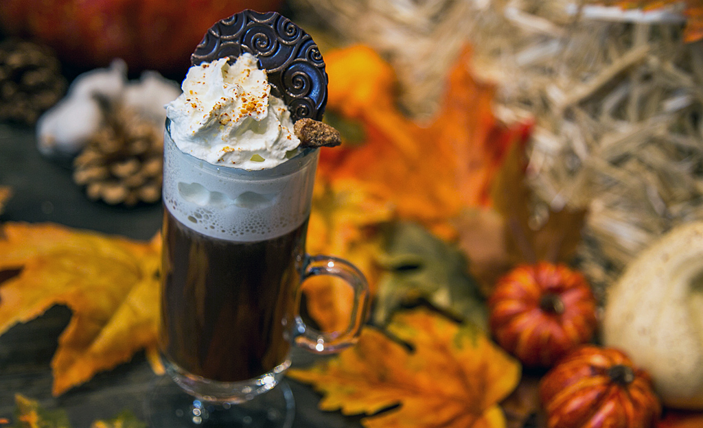 A warm fall drink with whipped cream